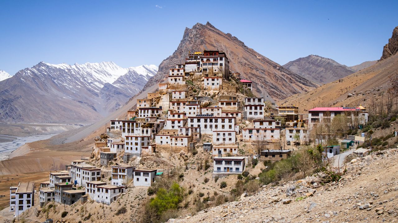 A scenic view of Key Monastery nestled in the Spiti Valley, surrounded by Himalayas.